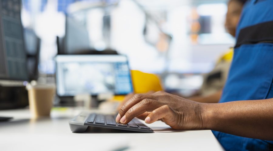 PC based solar employee reviews automation data in production factory, manufacturing industry focused on renewable energy. Engineer tracking solar panels and industrial performance. Close up.