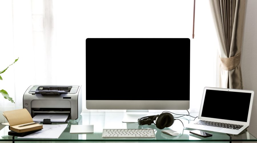 Modern home office with computer and labtop